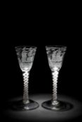A RARE PAIR OF 'PRIVATEER' OPAQUE TWIST WINE GLASSES C.1760 the round funnel bowls each engraved