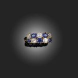 AN EDWARDIAN SAPPHIRE AND DIAMOND RING, OF 'CHEQUERBOARD' DESIGN