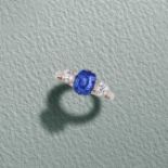 A SAPPHIRE AND DIAMOND RING