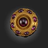 A VICTORIAN GARNET-SET TARGET BROOCH