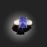 A TANZANITE AND DIAMOND RING