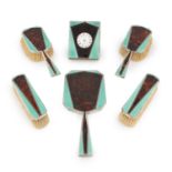 λ An Art Deco silver-mounted tortoiseshell and enamel dressing set,