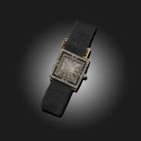 CARTIER, AN ART DECO ONYX AND DIAMOND WRISTWATCH