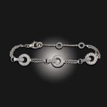 BULGARI, A 'BVLGARI BVLGARI' DIAMOND-SET GOLD BRACELET