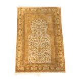A HEREKE SILK PRAYER RUG
