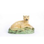 A STAFFORDSHIRE FIGURE OF A LEOPARD