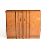 Attributed to Harry and Lou Epstein A burr-walnut cabinet or sideboard