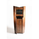 Attributed to Shapland and Petter, An Arts and Crafts corner cabinet