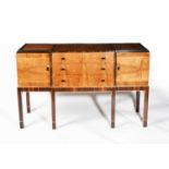 λ Attributed to Charles A Richter (1867-1946) An Art Deco macassar and walnut sideboard