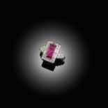 AN ART DECO RUBY AND DIAMOND CLUSTER RING