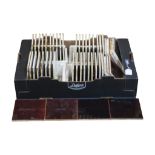 A box containing fifty treacle glazed fire surround inset tiles, 15 cm square