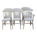 Six over-painted kitchen Windsor chairs. Four single and two carvers with spindlebacks.