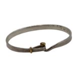 A Georg Jensen Torun bangle, in sterling silver and 18ct gold, inner diameter 61mm