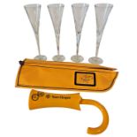 A set of four Waterford crystal glass flutes, together with a Veuve Clicquot 'parasol handle' bottle