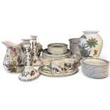 A large collection of Portmeirion Botanic garden ware comprising of graduated plates, candle sticks,