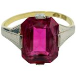 A synthetic ruby ring, set with a scissor-cut synthetic ruby measuring 9.1mm x 7.2mm, in 18ct