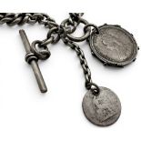 A sterling silver double Albert watch chain, with T-bar and suspended with two coin pendants, 70