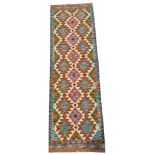 A Maimana kilim runner with white geometric detail. 193cm x 64cm.