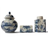 Three pieces of Isis ware in a blue and white colour way, comprising of flower brick, tea caddy