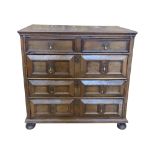 An 18th century walnut block fronted two sectional chest of three long and two short drawers with