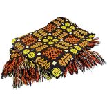 A good traditional Welsh wool rug or blanket, in shades of red, ochre, yellow, black and white,