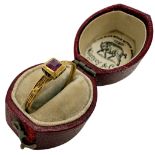 A Renaissance gold ring set with a rectangular faceted ruby within a raised square bezel, the