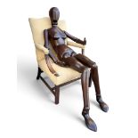 A rare and impressive life-size wooden artist's lay figure or manikin of the female form, fully
