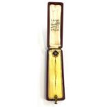 Boxed 18 carat antique art deco stick pin featuring stone, pearl set detail