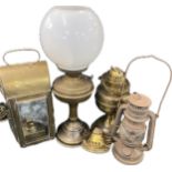 Selection of vintage brass oil lamps and lanterns
