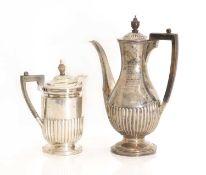A silver coffee pot and hot water jug,