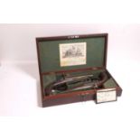 A pair of Charles Moore patent cased double-barrelled percussion pistols, c.1830,