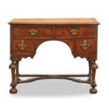A George I / George II walnut and cross banded writing table, early 18th century,