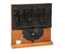 A 17th Century German Iron Chest Lock, through bolt with domed cover over pin housing 23cm by 24cm