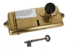 A Brass Door Lock, circa 1860, with rounded edges to the case, four lever with key, slide turned