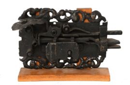 An Iron Latch, Dutch, late 17th century, with finely fretted and repousse engraved foliate