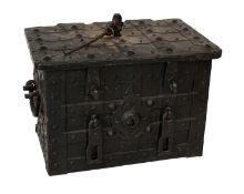 A 17th Century German Chest of Armada Type, with strapped wrought iron body, the hinged lid