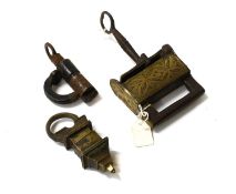A 19th Century Tuarg Padlock, with engraved brass body and iron key A 19th Century Ebonised Padlock,
