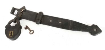 A Victorian Iron Padlock, with warded key, heavy hinge clasp and staple