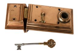 A Brass Rim Lock, stepped case and staple, with key, ornamental bow operable both sides (warded).