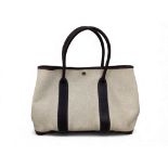 Hermès: An ecru toile and brown leather Garden Party 35