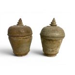Two similar Khmer style pottery jars and covers, possibly 12th century