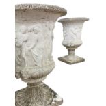 A pair of early 20th century Medici cast stone garden urns,
