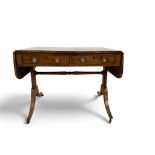 A Regency mahogany and ebony line inlaid sofa table,