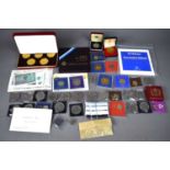A collection of commemorative coins and banknotes to include Isle of Man Commemorative Crowns,