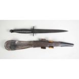 A Fairburn Sykes style commando knife by John Nowill & Sons of Sheffield, with leather scabbard.