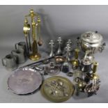 A quantity of metalware to include a fireside companion set, pewter tankards, brass candlesticks,