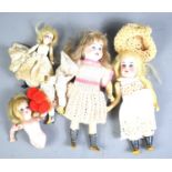 A group of early 20th century German bisque headed dolls, three having papier mache jointed