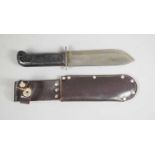 A British Military issue D Type survival knife 127/8214 with scabbard, dated 1983.