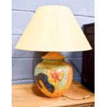 A large Hubert Olivier Studio pottery style lamp base, boldly painted with fruits, large apricot