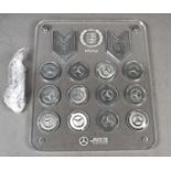 Formula 1 memorabilia: A Mercedes AMG F1 Team 2017 World Champions medal set, displayed in a perspex